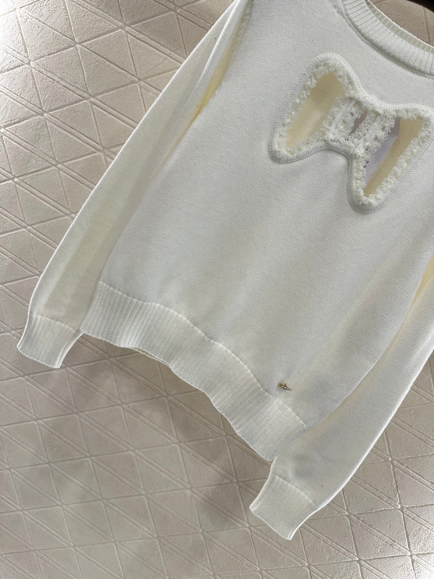 C 25 Hollow Bow Knitted Wool Sweater