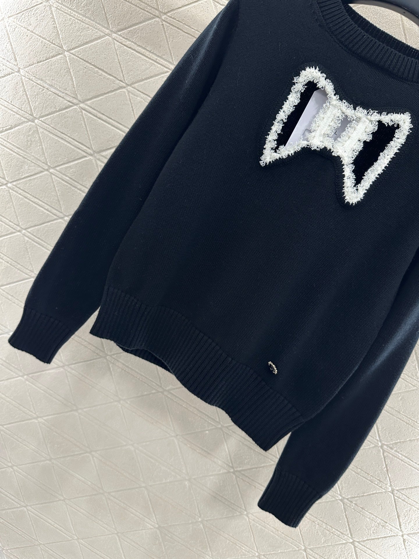 C 25 Hollow Bow Knitted Wool Sweater