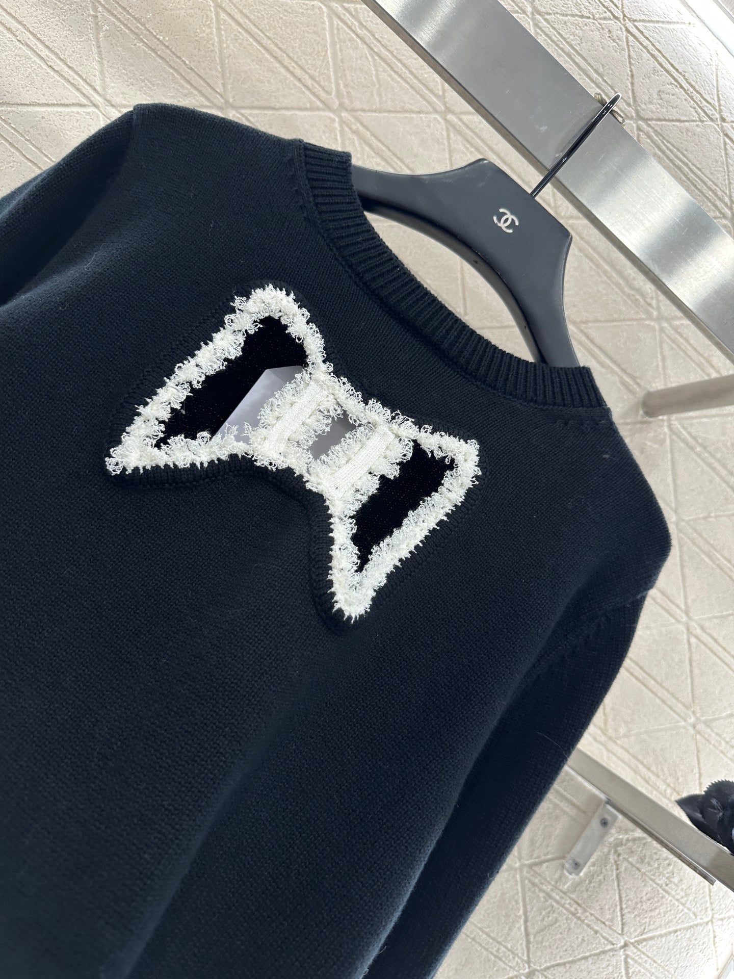 C 25 Hollow Bow Knitted Wool Sweater