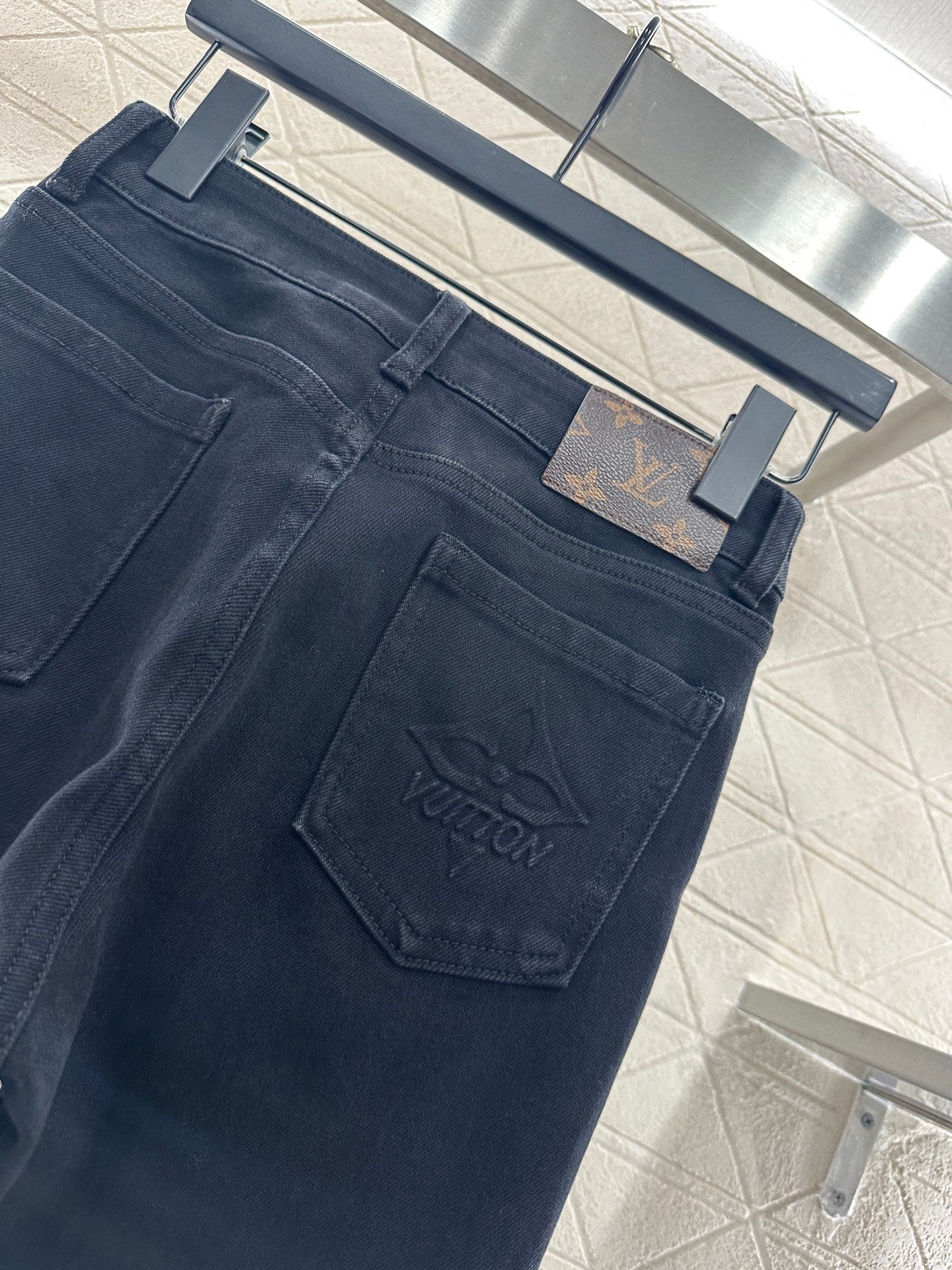L 25 Leather label denim trousers