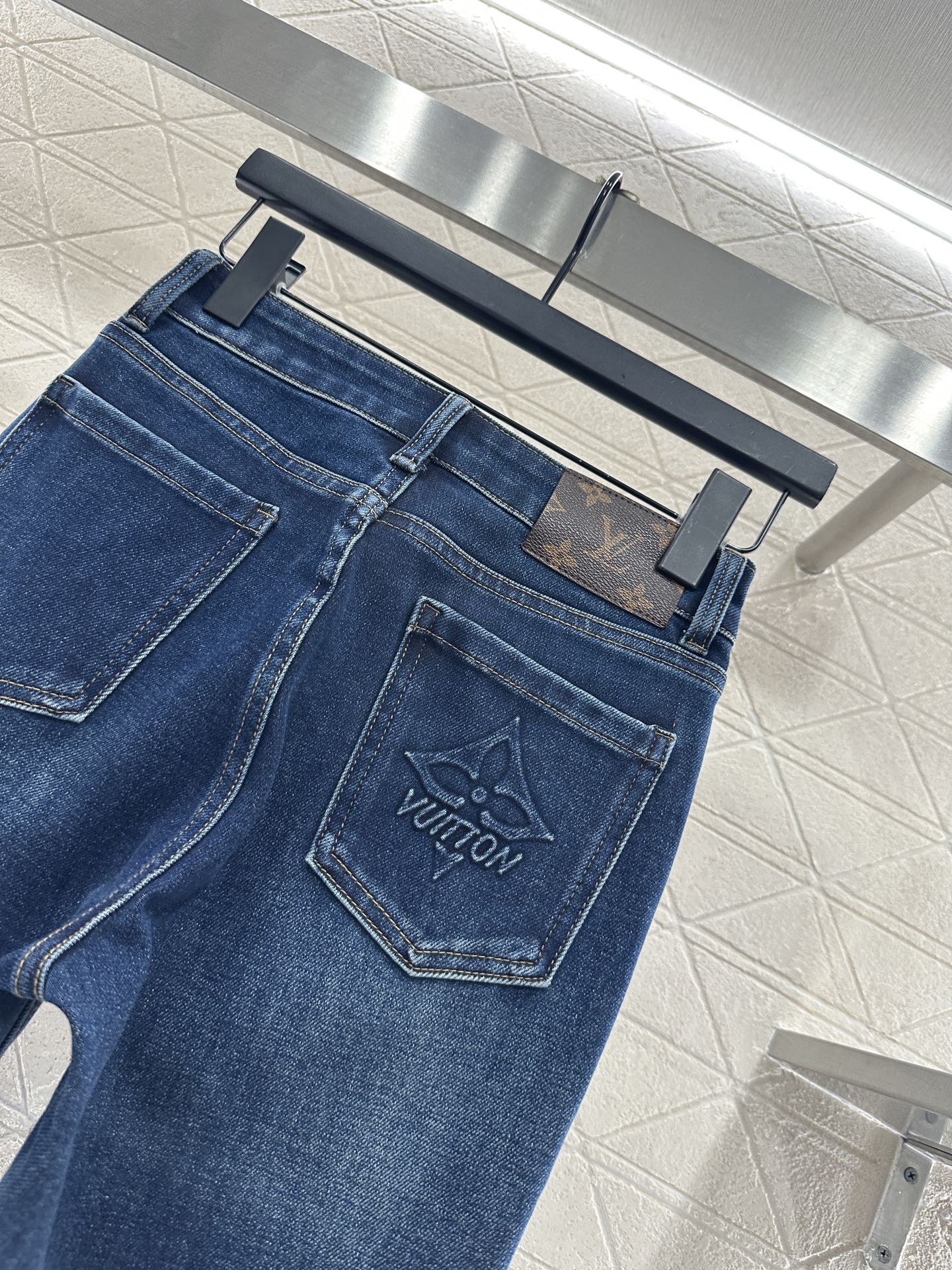 L 25 Leather label denim trousers