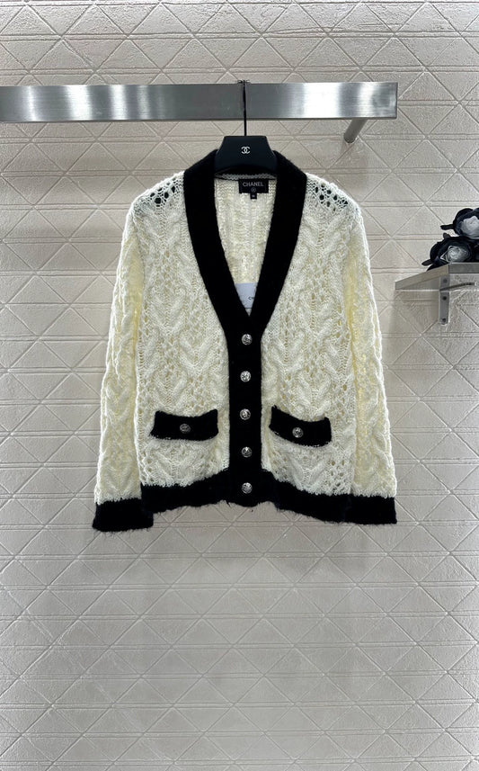 C 25 Contrast-color crochet cardigan.