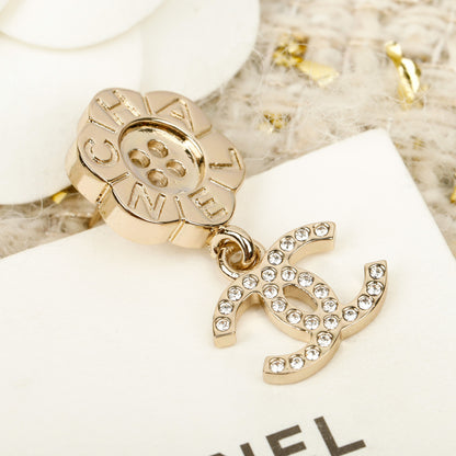 C 25 Button flower + logo earrings